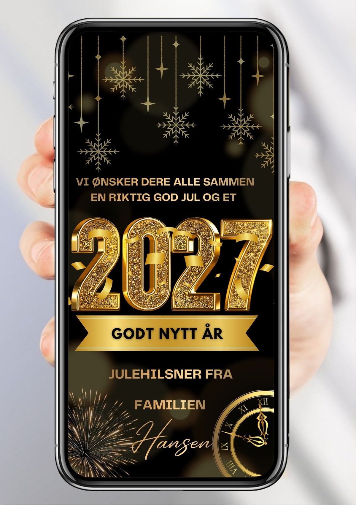 Digitalt julekort vist på mobil med snøfnugg, stjerner, fyrverkeri og en klokke på mørk bakgrunn, gulltallet 2027 og personlig julehilsen fra familien.